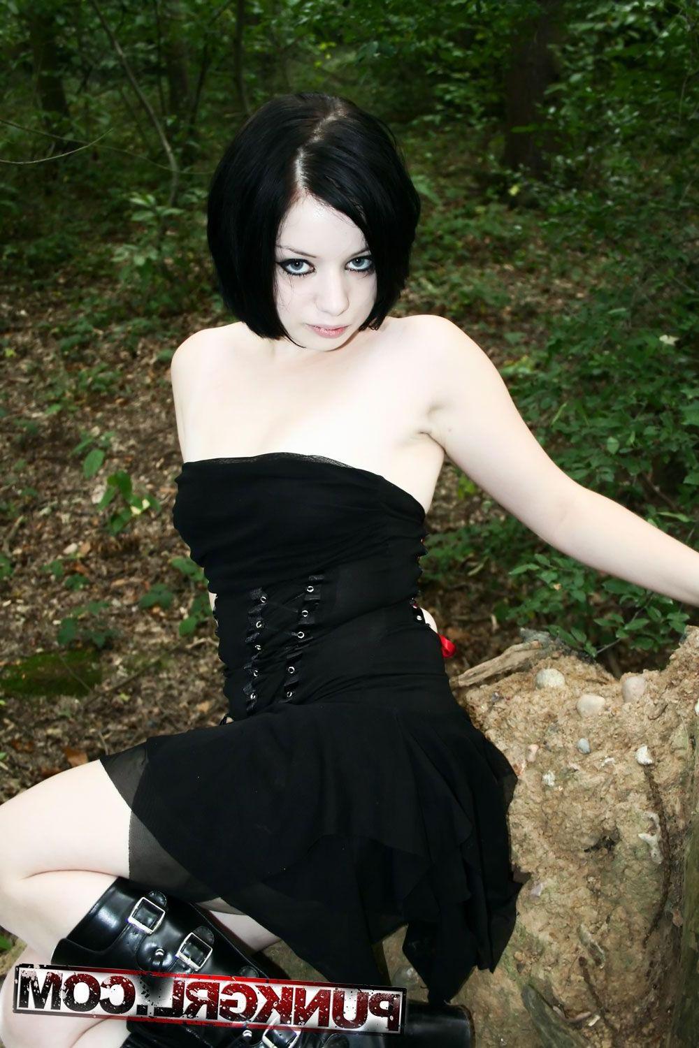 20P Pictures of teen girl Toxica showing off her titties in the woods