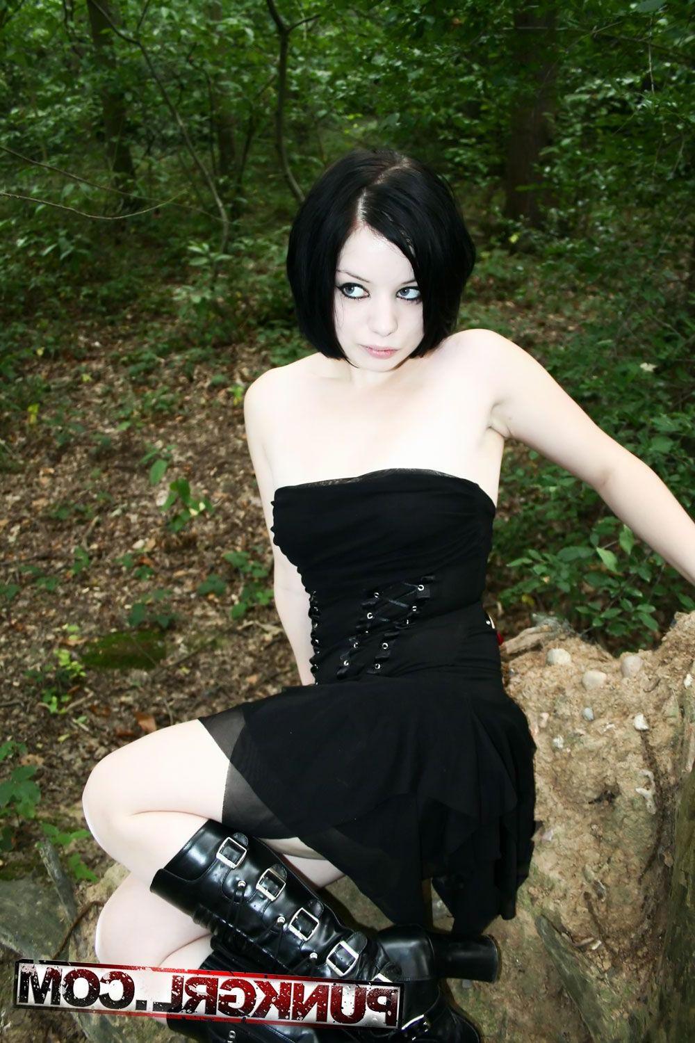 20P Pictures of teen girl Toxica showing off her titties in the woods