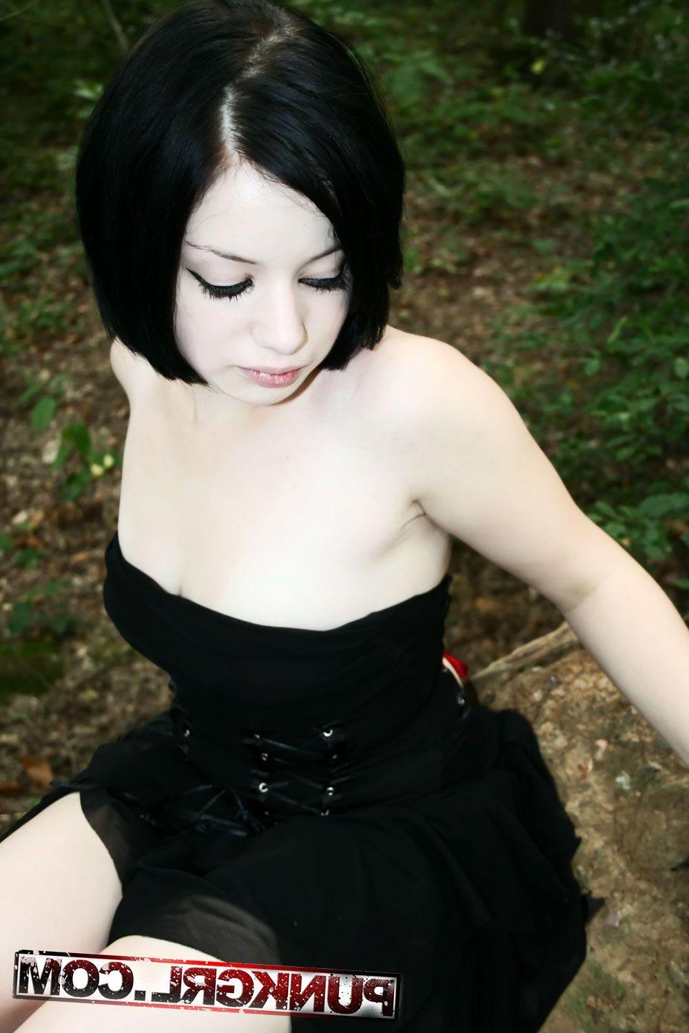 20P Pictures of teen girl Toxica showing off her titties in the woods