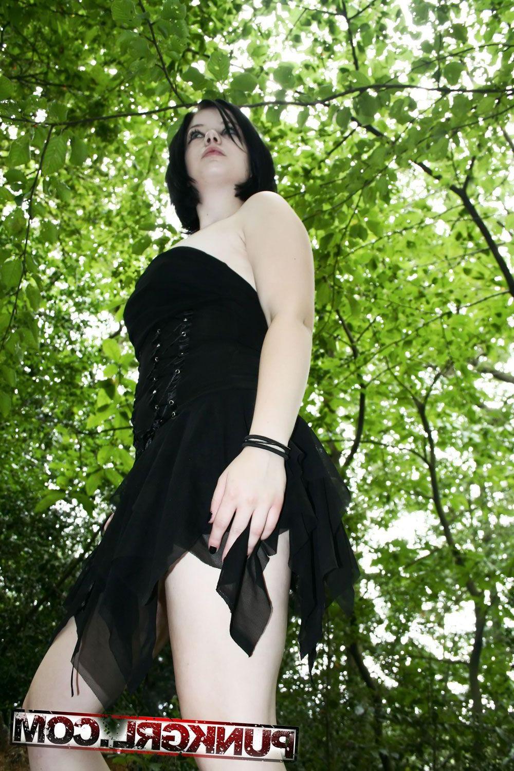 20P Pictures of teen girl Toxica showing off her titties in the woods