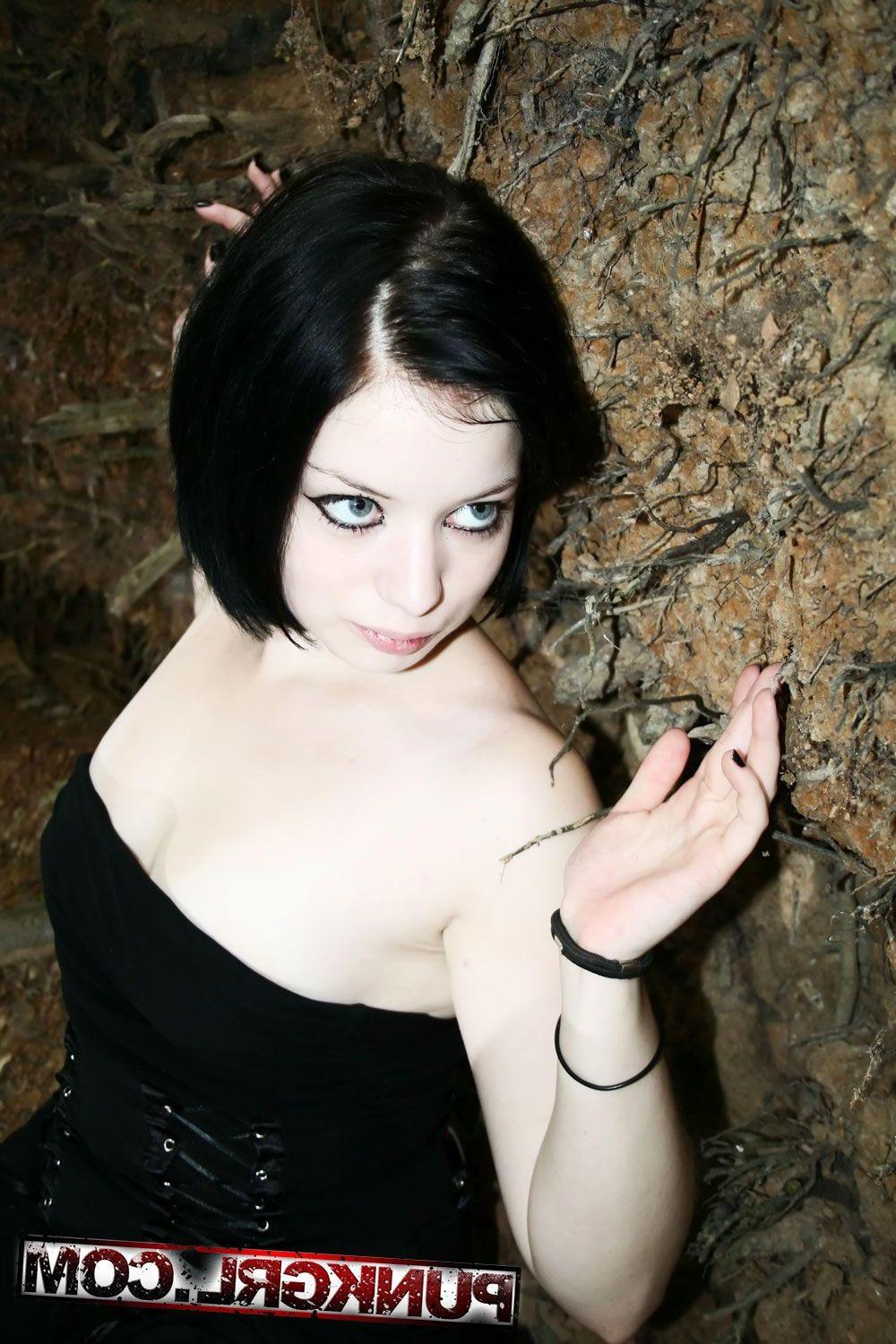 20P Pictures of teen girl Toxica showing off her titties in the woods