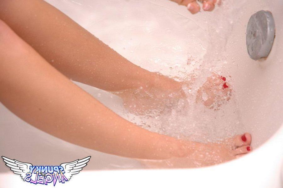 20P Pictures of a busty teen angel getting all wet