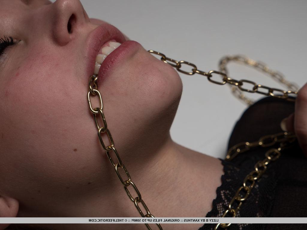 16P Blonde hottie Lizzy B is chained up for you in "Golden Touch"