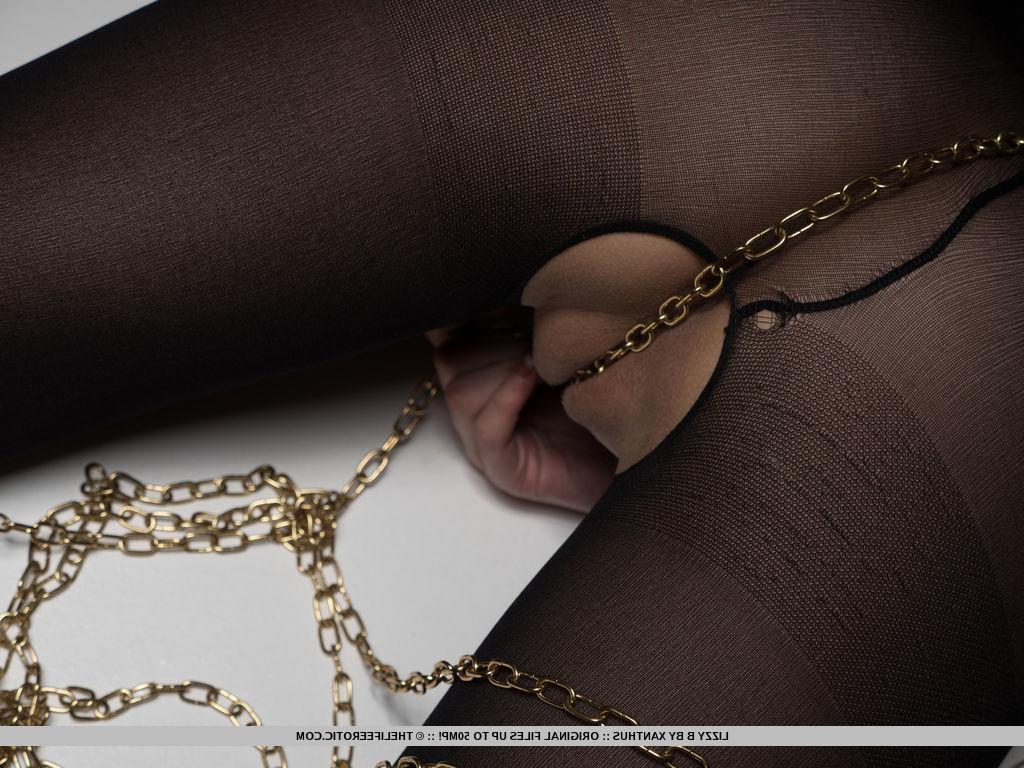 16P Blonde hottie Lizzy B is chained up for you in "Golden Touch"