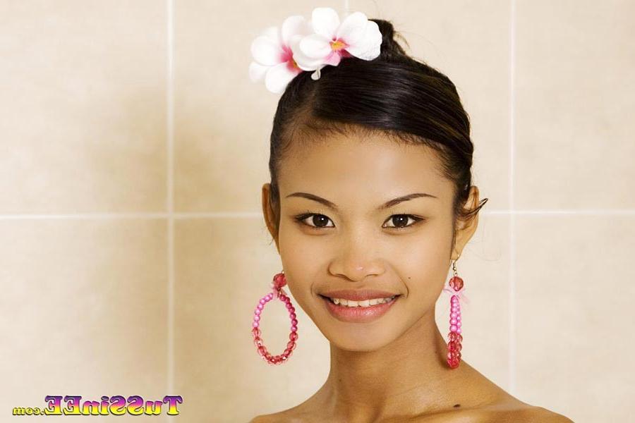16P Little Thai teen Tussinee takes a milk bath and shows off her body