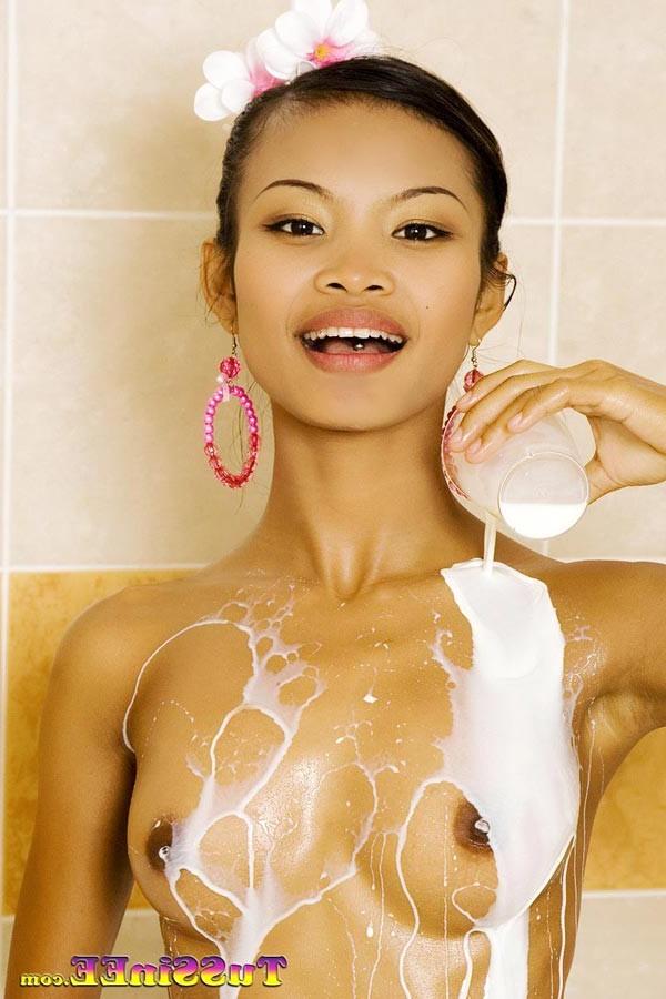 16P Little Thai teen Tussinee takes a milk bath and shows off her body