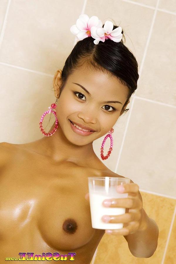 16P Little Thai teen Tussinee takes a milk bath and shows off her body