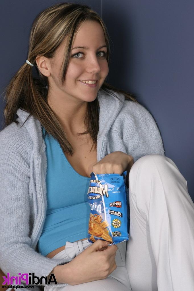 16P Cute teen girl eats chips
