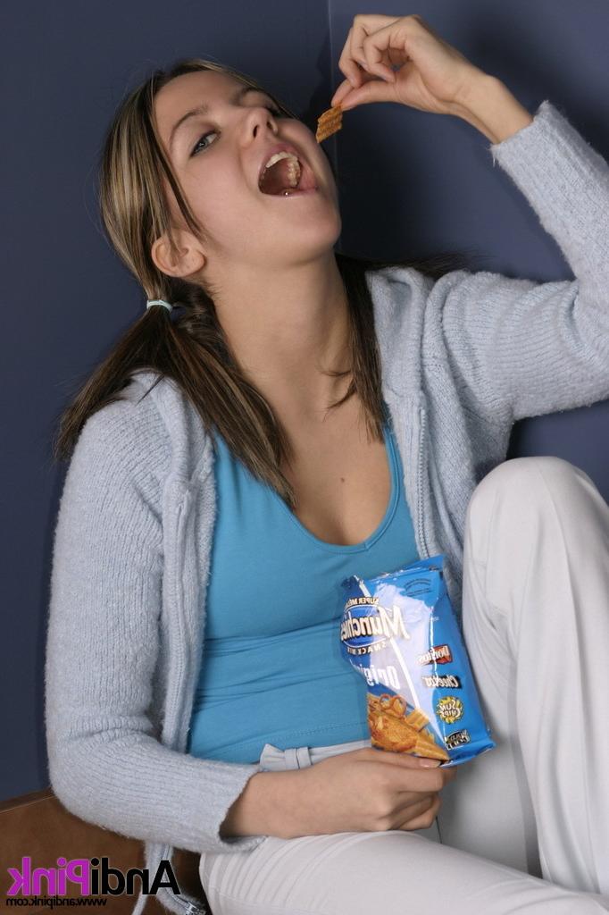 16P Cute teen girl eats chips