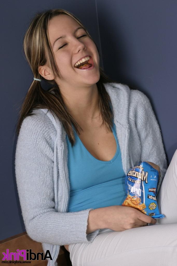 16P Cute teen girl eats chips