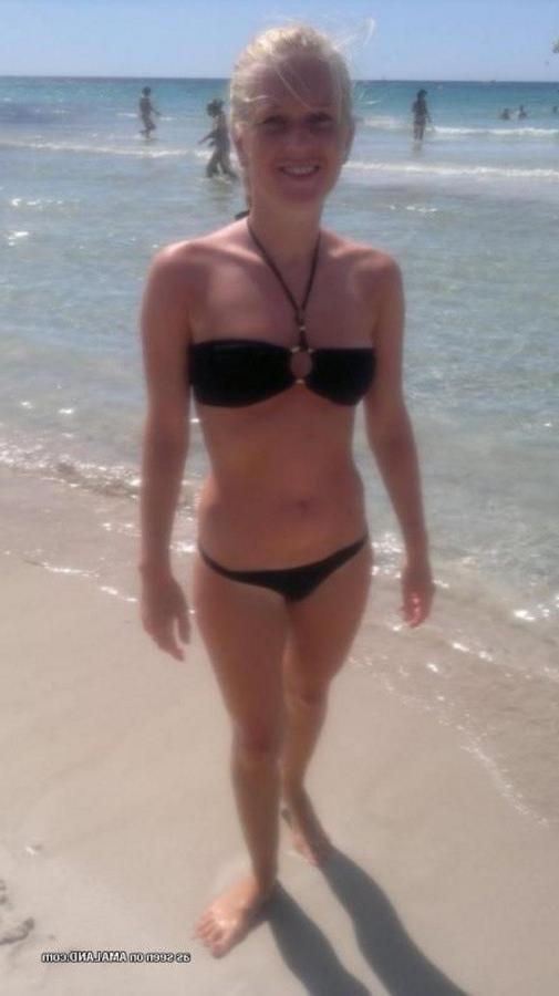 12P Photos of a sexy blonde babe posing in her black bikini