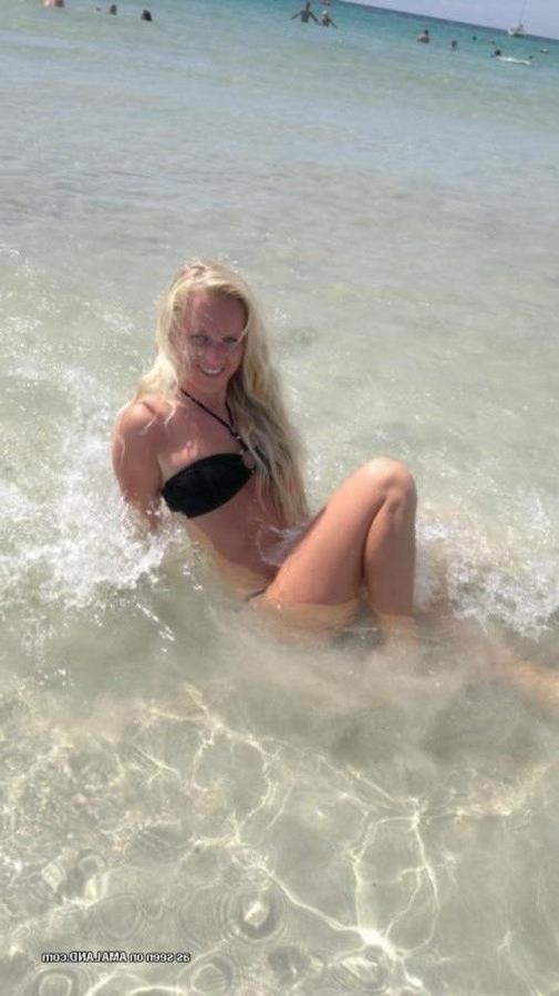 12P Photos of a sexy blonde babe posing in her black bikini