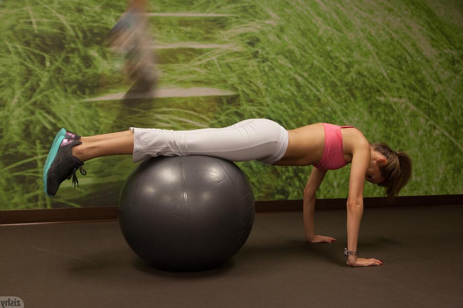 20P Lithe teen girl in white yoga pants and pink sports bra stretching and exercisin