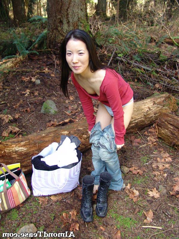 14P Almond Tease outdoors changing into mini skirt
