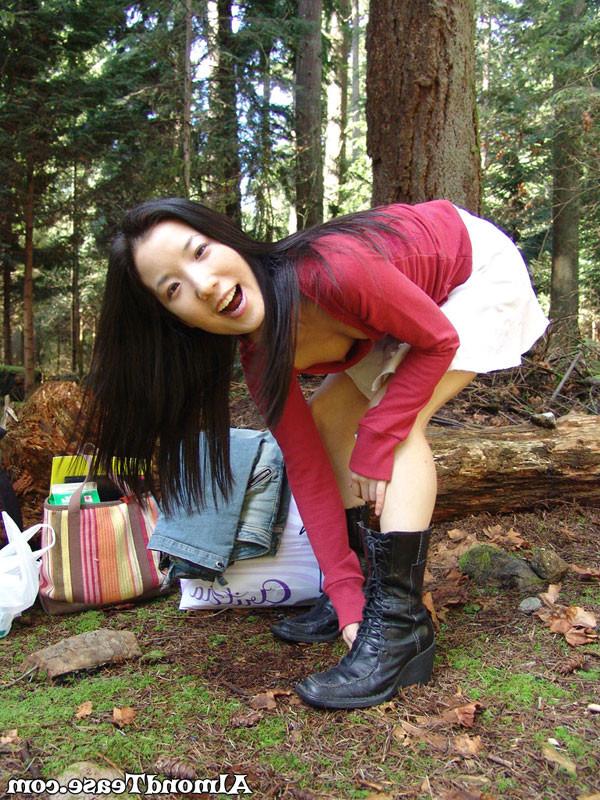 14P Almond Tease outdoors changing into mini skirt