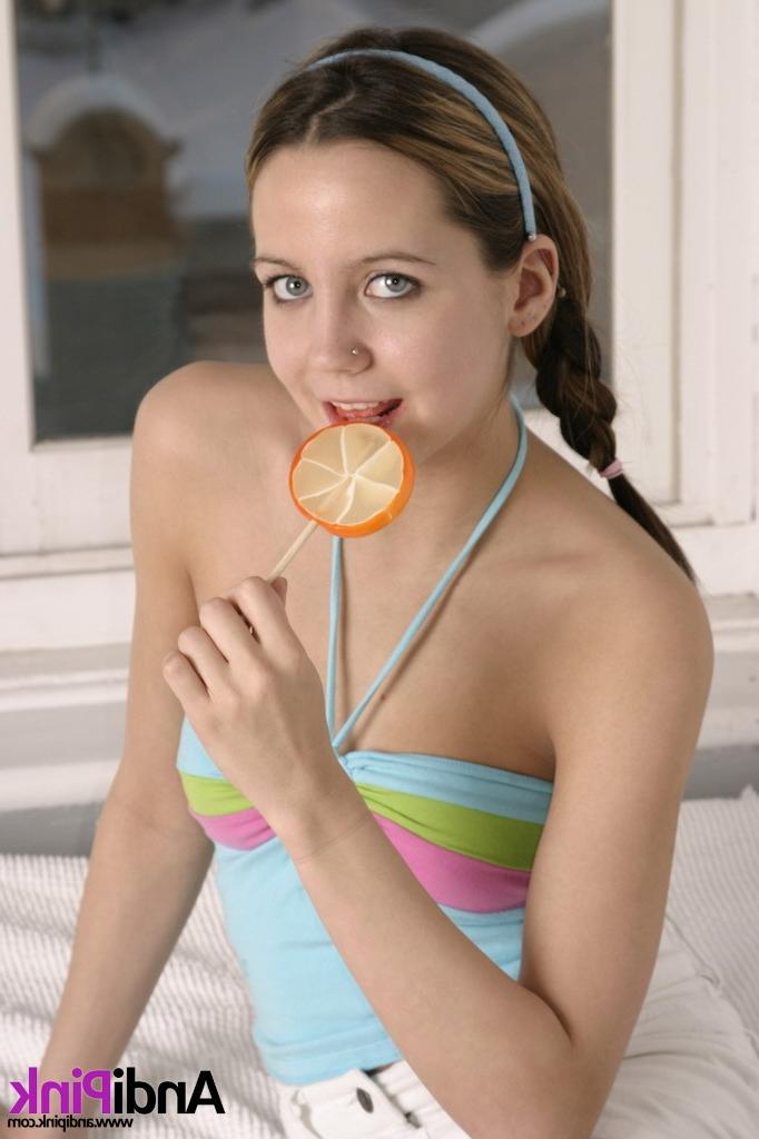 16P Cute teen girl licks lollypop