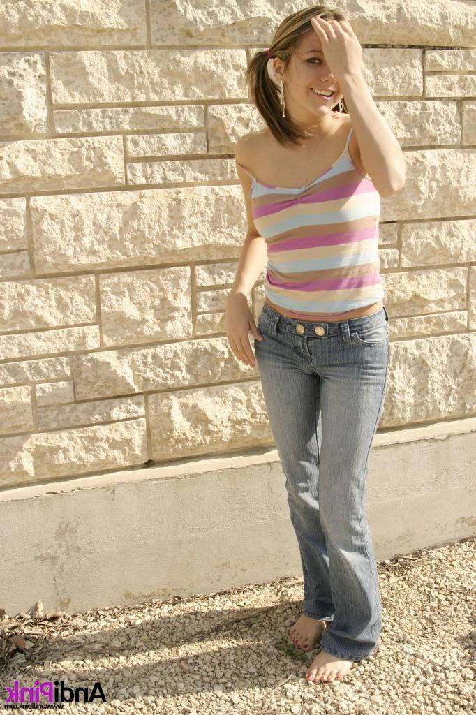 16P Cute teen girl in pigtails outdoors