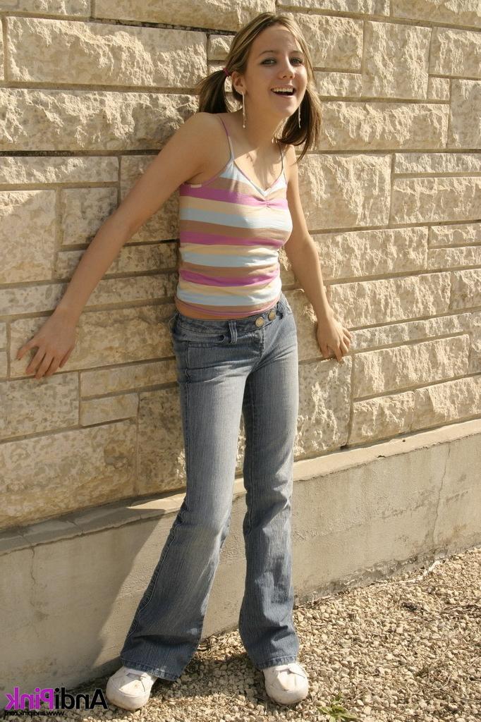 16P Cute teen girl in pigtails outdoors