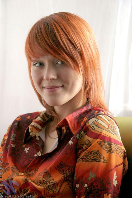 10P Cute redhead has her shirt open and no bra under there