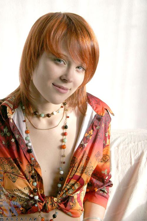 10P Cute redhead has her shirt open and no bra under there