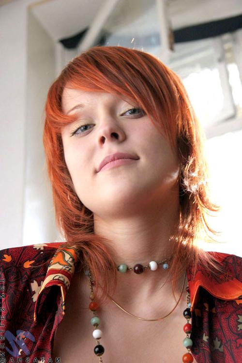 10P Cute redhead has her shirt open and no bra under there