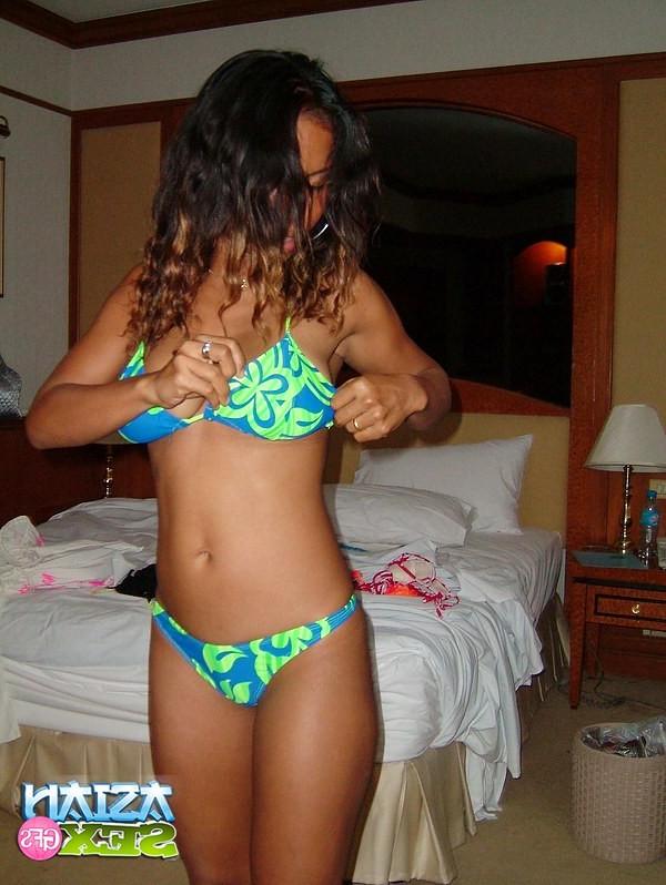 12P Pretty asian bikini girl shows her sexy body