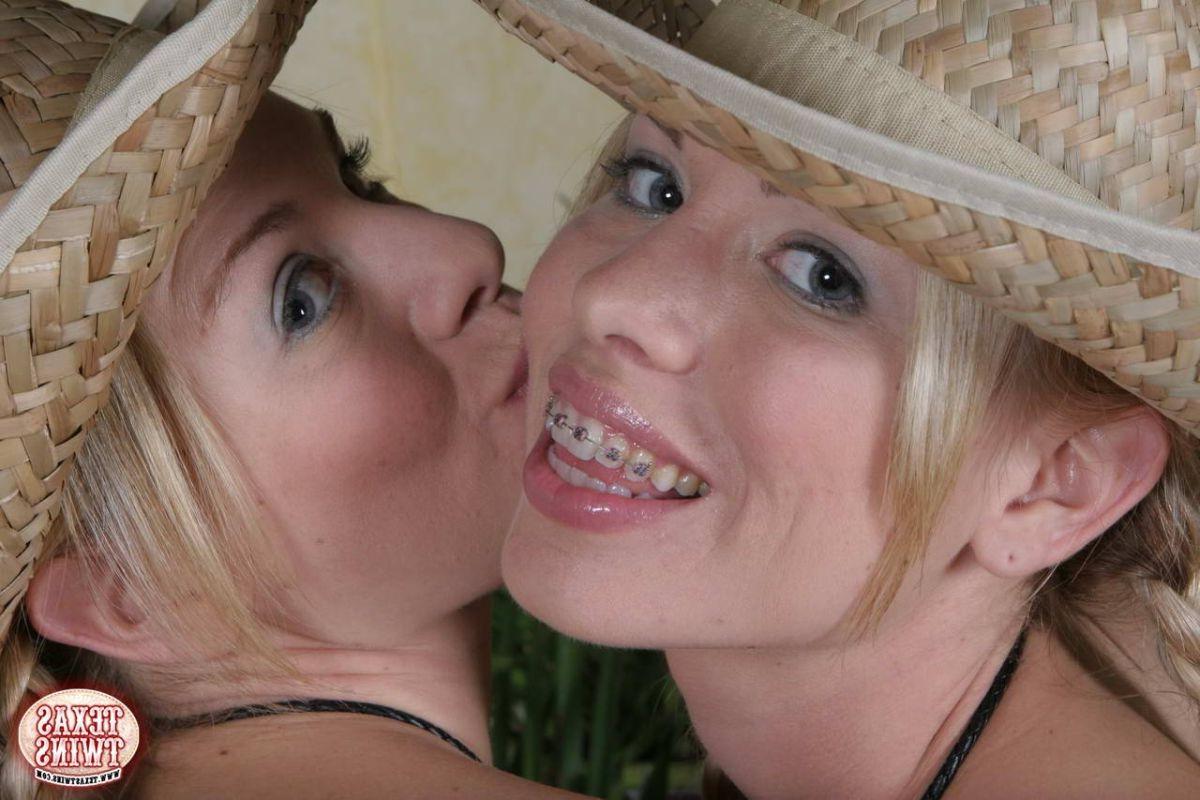 16P Texas twins taking top and tiny panties off to have fun on a red sofa