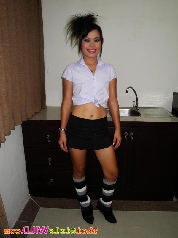 16P Hot Thai schoolgirl Nah strips then rides a hard white cock