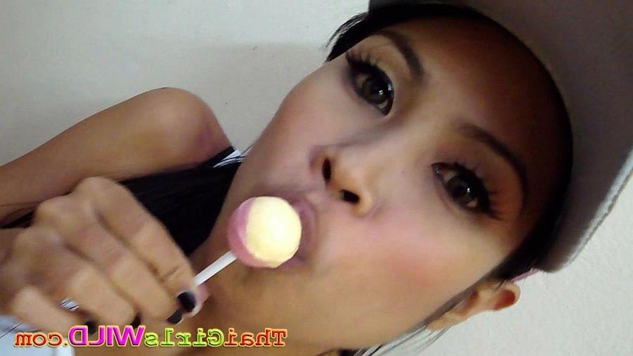 16P Hot THai babe named Ni licks and sucks a lolipop to tease us