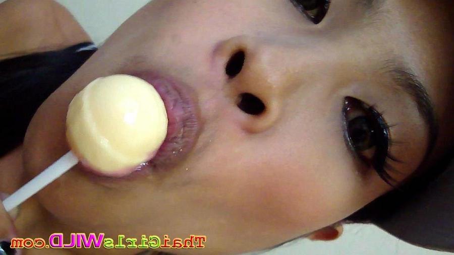 16P Hot THai babe named Ni licks and sucks a lolipop to tease us