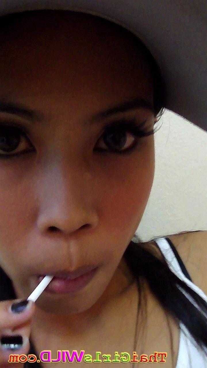 16P Hot THai babe named Ni licks and sucks a lolipop to tease us