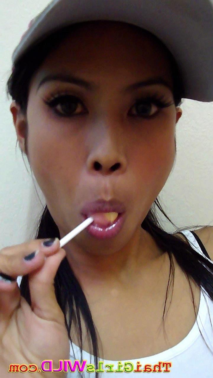 16P Hot THai babe named Ni licks and sucks a lolipop to tease us