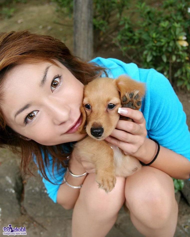 15P Petite japanese babe Nao poses outdoors shows tits