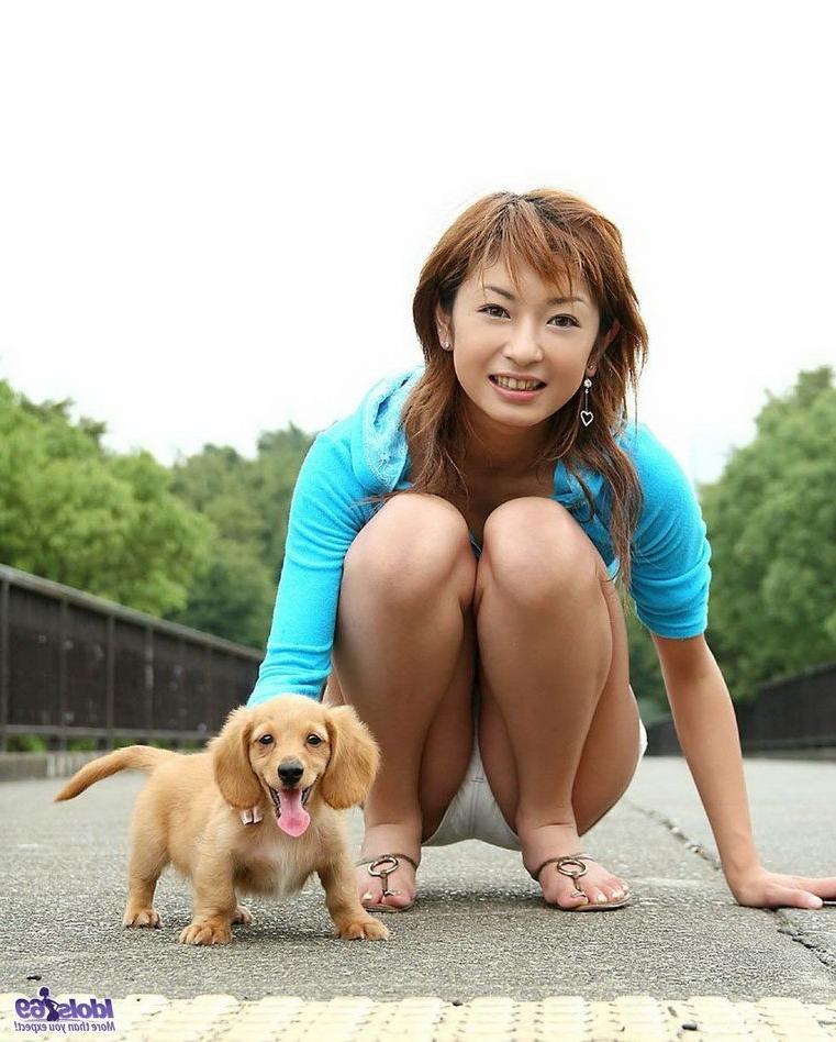 15P Petite japanese babe Nao poses outdoors shows tits
