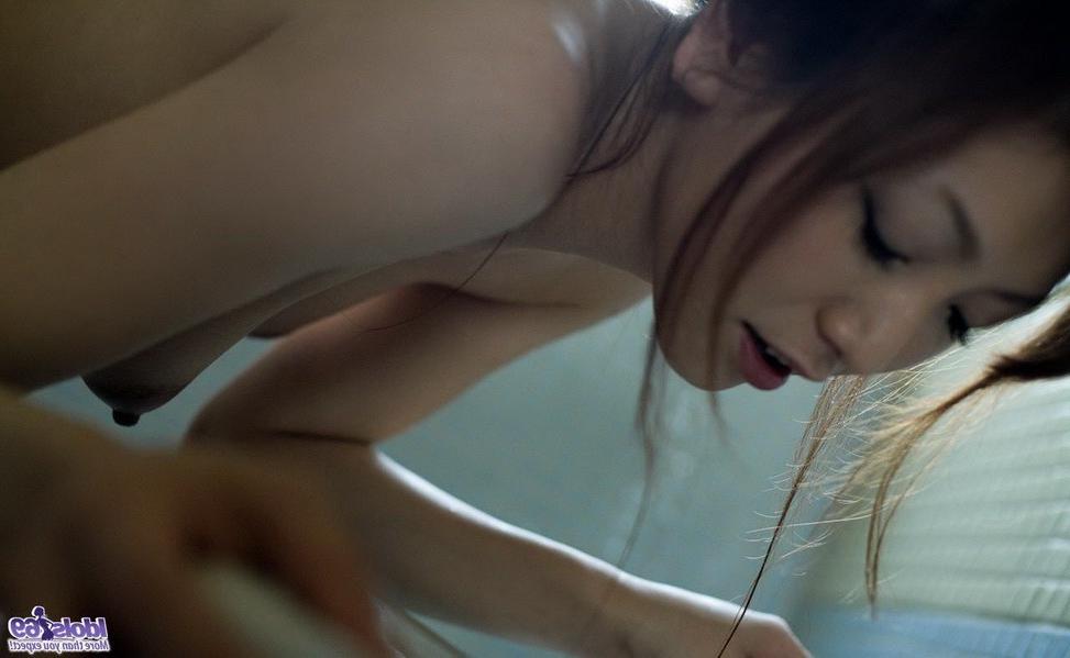 15P Cute japanese teen Emi Harukaze poses showing tits