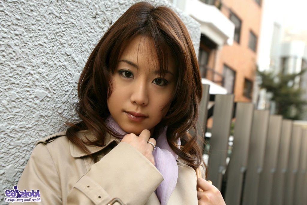 15P Misa poses showing big tits in her lingerie while on the bed