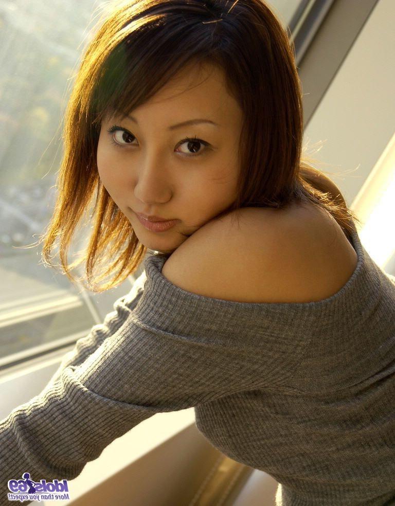 15P Shiho shows off her tight ass as she takes her clothes off