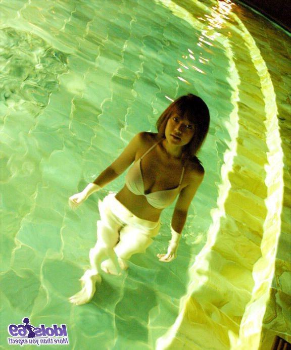 15P Asian tramp enjoys modeling her naked big tits in the sun