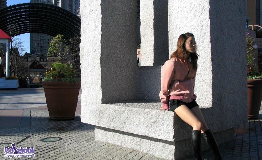 15P Cute japanese babe shows off her tight ass and sexy thong