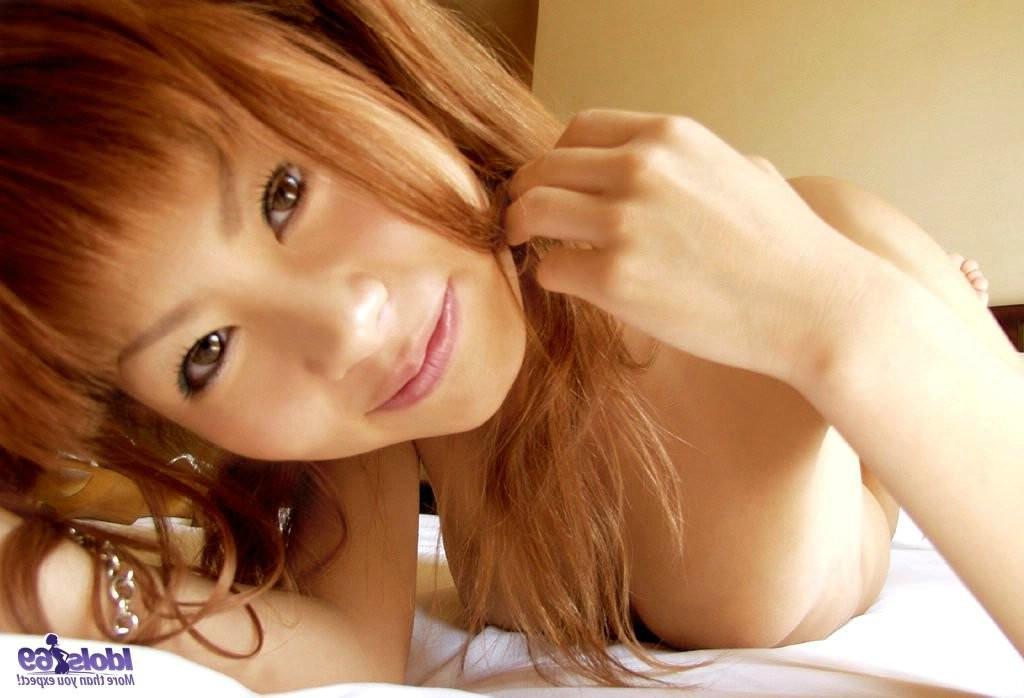 15P Petite japanese girl jumps on her bed and gets naked