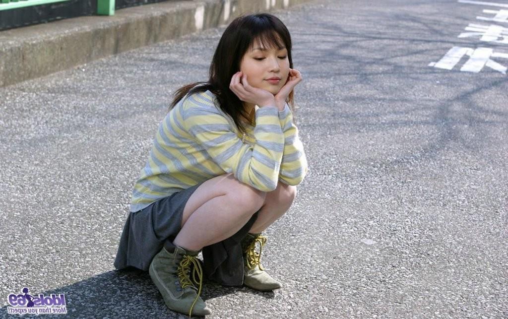 15P Japanese babe shows off her bra and panties