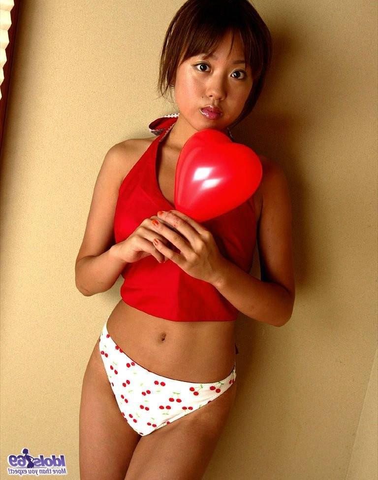 15P Sexy petite Japanese girl having fun under the sun at the beach