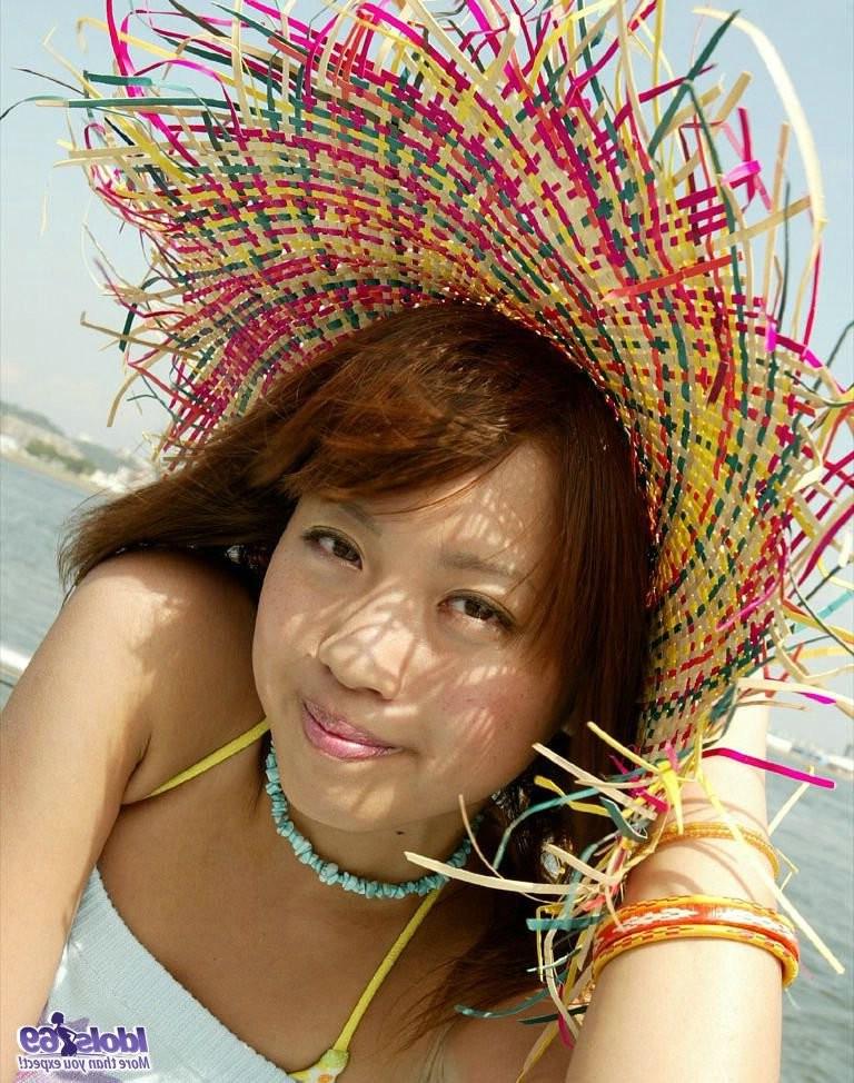 15P Sexy petite Japanese girl having fun under the sun at the beach