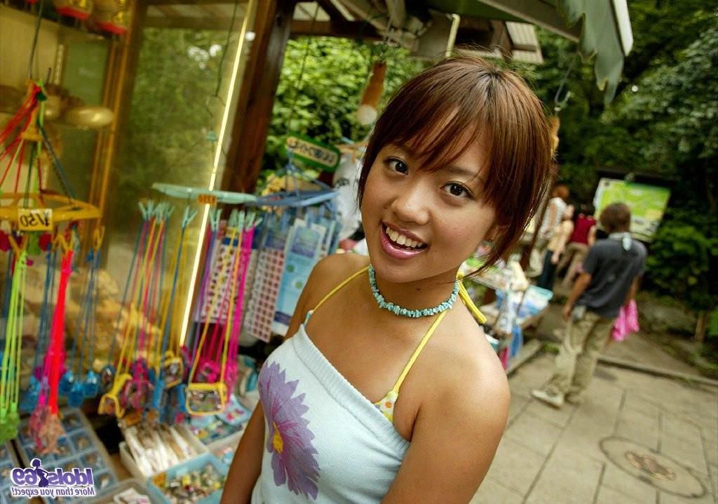 15P Sexy petite Japanese girl having fun under the sun at the beach