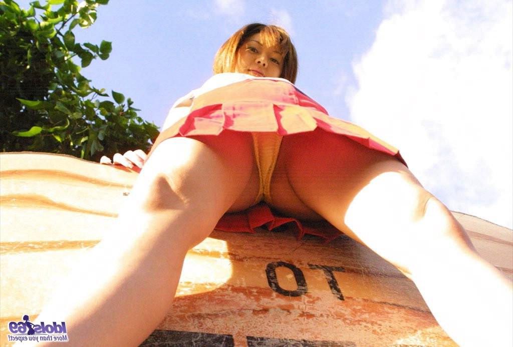 15P Naughty Japanese babe stripping naked and sexy at the beach