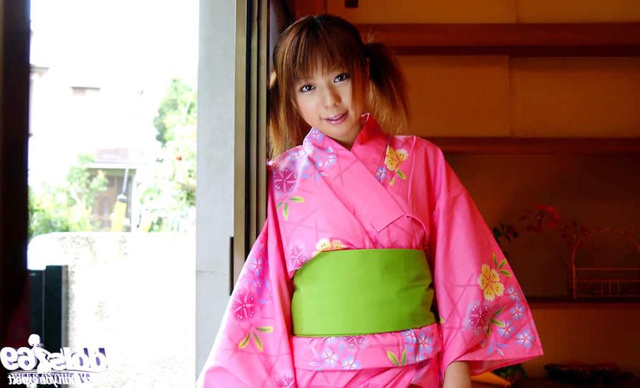 15P Cute japanese girl wearing a pink kimono