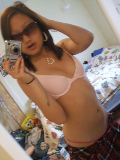 16P Cute Asian selfshooter with a sexy body plays with the camera in her room