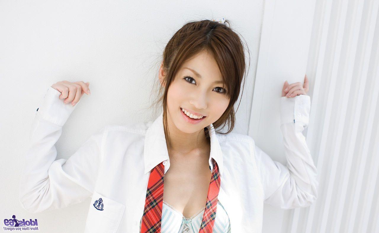 15P Lovely Japanese schoolgirl strips and shows off her hairy pussy