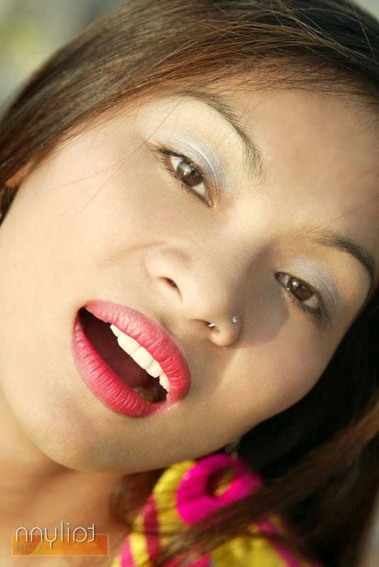 15P Incredibly hot Asian babe takes off her flashy clothes outdoors