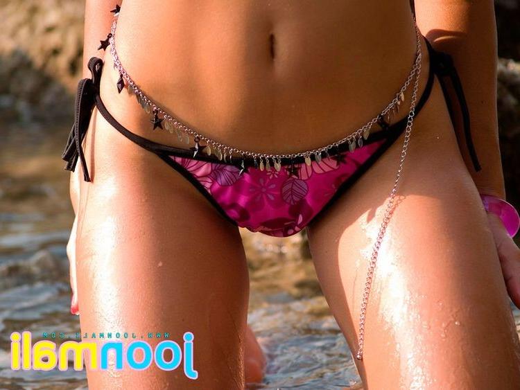15P Joon Mali is a cute thai chick in a bikini by the rocks